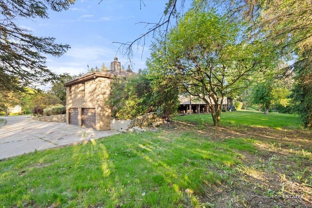 21824 Cambridge Dr, Kildeer, IL 60047 - view of green lawn with a garage and concrete driveway