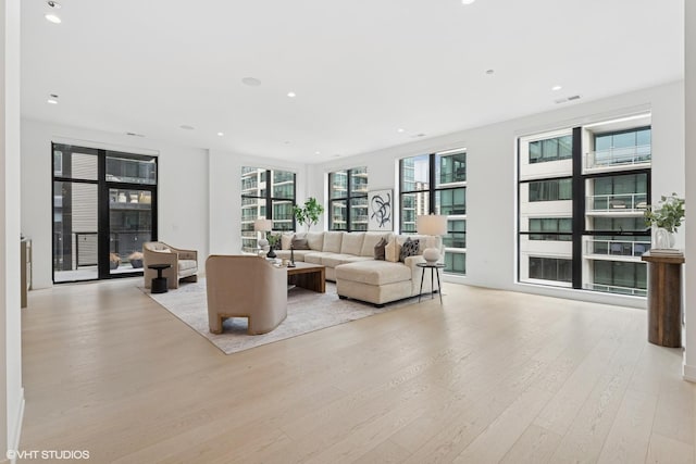 128 S Green St Unit 5Ab, Chicago, IL 60607 - living room featuring light wood-type flooring and recessed lighting