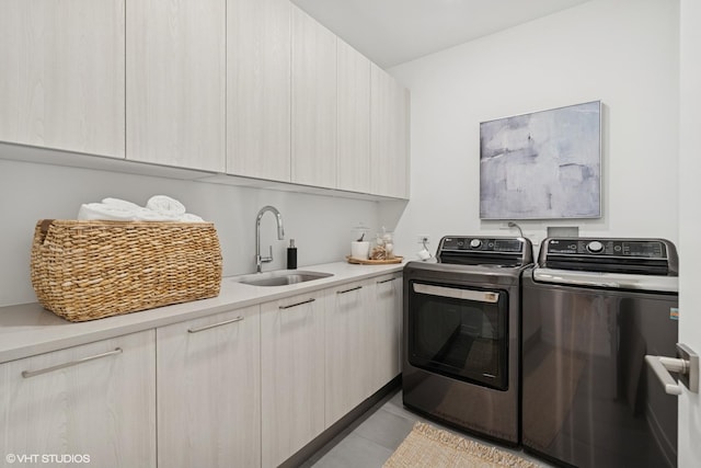 128 S Green St Unit 5Ab, Chicago, IL 60607 - laundry area with washing machine and clothes dryer, cabinet space, and light tile patterned floors
