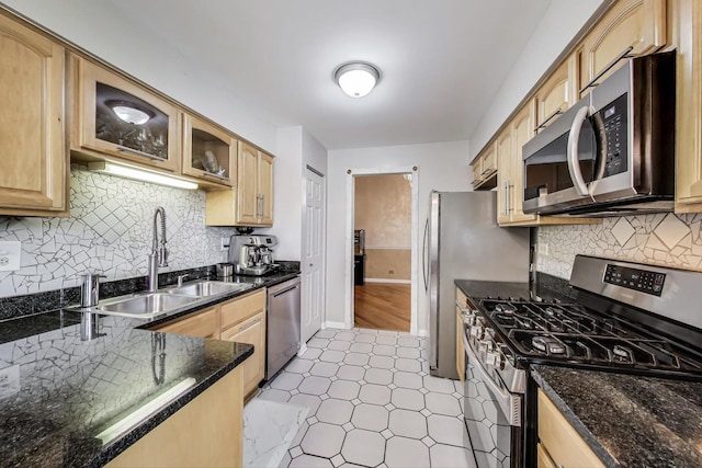 738 Hapsfield Ln Unit 7A2, Buffalo Grove, IL 60089 - kitchen with appliances with stainless steel finishes, backsplash, dark stone countertops, glass insert cabinets, and light brown cabinetry