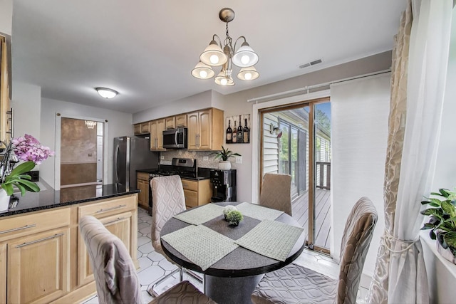 738 Hapsfield Ln Unit 7A2, Buffalo Grove, IL 60089 - dining area featuring a chandelier and light tile patterned flooring
