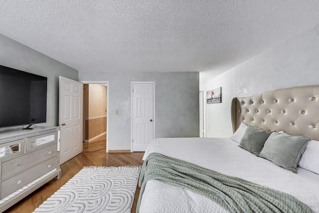 738 Hapsfield Ln Unit 7A2, Buffalo Grove, IL 60089 - bedroom featuring a textured ceiling and wood finished floors