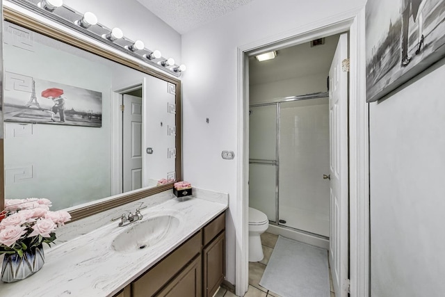 738 Hapsfield Ln Unit 7A2, Buffalo Grove, IL 60089 - bathroom featuring vanity, a shower stall, tile patterned flooring, and a textured ceiling