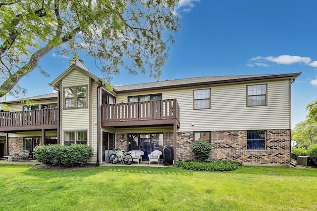 738 Hapsfield Ln Unit 7A2, Buffalo Grove, IL 60089 - rear view of property with brick siding, a lawn, and a chimney