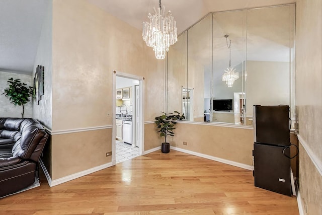 738 Hapsfield Ln Unit 7A2, Buffalo Grove, IL 60089 - entryway with a chandelier, wood finished floors, and high vaulted ceiling