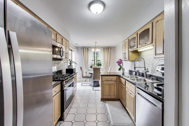 738 Hapsfield Ln Unit 7A2, Buffalo Grove, IL 60089 - kitchen with appliances with stainless steel finishes, dark countertops, backsplash, and a chandelier