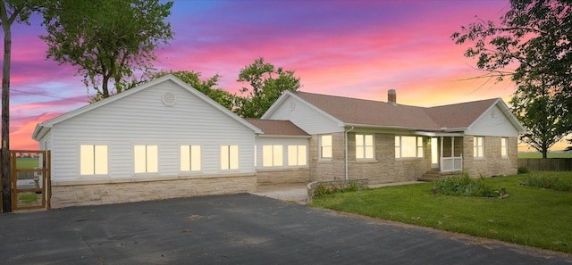 9101 US Highway 36, Metcalf, IL 61940 - ranch-style home with stone siding, a front lawn, and a chimney