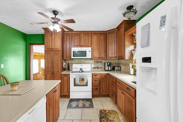 9101 US Highway 36, Metcalf, IL 61940 - kitchen with white appliances, decorative backsplash, light countertops, and ceiling fan