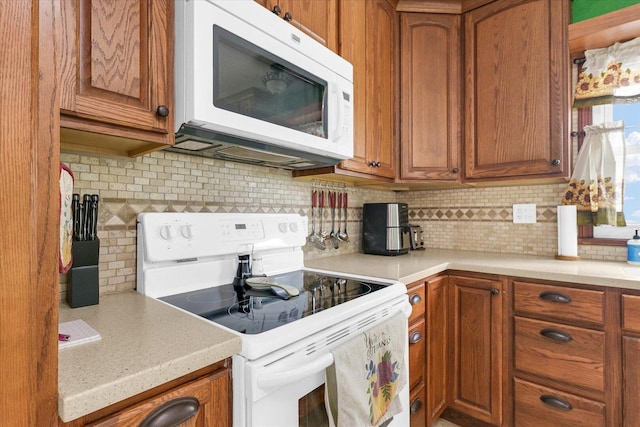 9101 US Highway 36, Metcalf, IL 61940 - kitchen featuring white appliances, tasteful backsplash, and brown cabinets