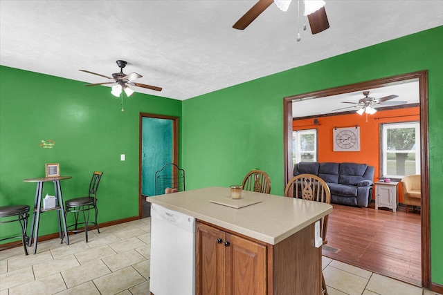 9101 US Highway 36, Metcalf, IL 61940 - kitchen featuring a ceiling fan, white dishwasher, and light tile patterned floors