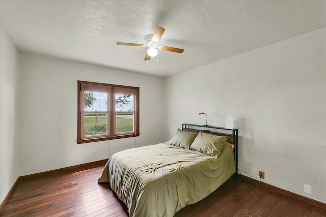 9101 US Highway 36, Metcalf, IL 61940 - bedroom featuring dark wood-type flooring, ceiling fan, and a textured ceiling