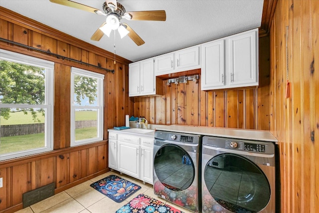 9101 US Highway 36, Metcalf, IL 61940 - laundry room featuring washing machine and dryer, wooden walls, light tile patterned flooring, cabinet space, and ceiling fan