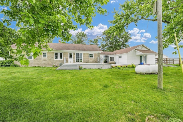 9101 US Highway 36, Metcalf, IL 61940 - back of property featuring a lawn and stone siding