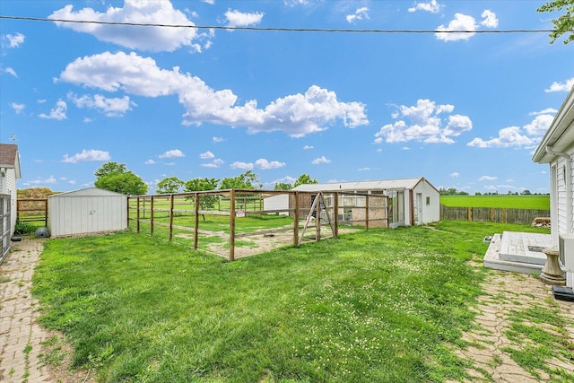 9101 US Highway 36, Metcalf, IL 61940 - fenced backyard featuring a shed
