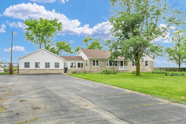 9101 US Highway 36, Metcalf, IL 61940 - ranch-style home with stone siding, driveway, and a front lawn