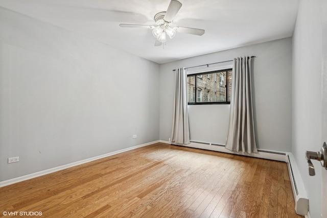 2336 N Commonwealth Ave Unit 108, Chicago, IL 60614 - empty room with a ceiling fan, light wood-type flooring, and a baseboard radiator