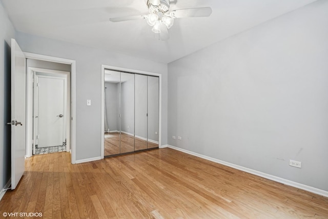 2336 N Commonwealth Ave Unit 108, Chicago, IL 60614 - unfurnished bedroom featuring light wood-type flooring, a closet, and ceiling fan
