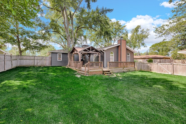 717 Bittersweet Ln, New Lenox, IL 60451 - back of house with a gazebo, a chimney, a wooden deck, and a fenced backyard