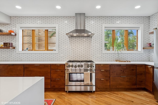9333 S Oakley Ave, Chicago, IL 60643 - kitchen featuring high end stainless steel range oven, wall chimney range hood, light countertops, modern cabinets, and brown cabinets