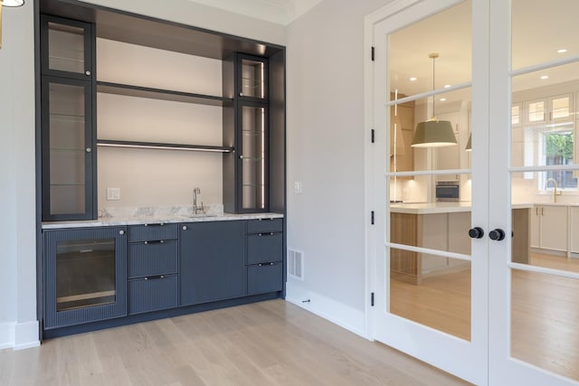 1437 Ashland Ave, River Forest, IL 60305 - indoor wet bar featuring light wood-style floors and french doors