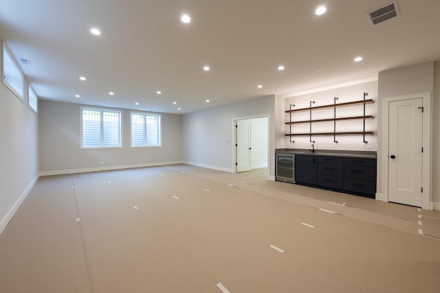 1437 Ashland Ave, River Forest, IL 60305 - unfurnished living room with beverage cooler, bar with sink, and recessed lighting