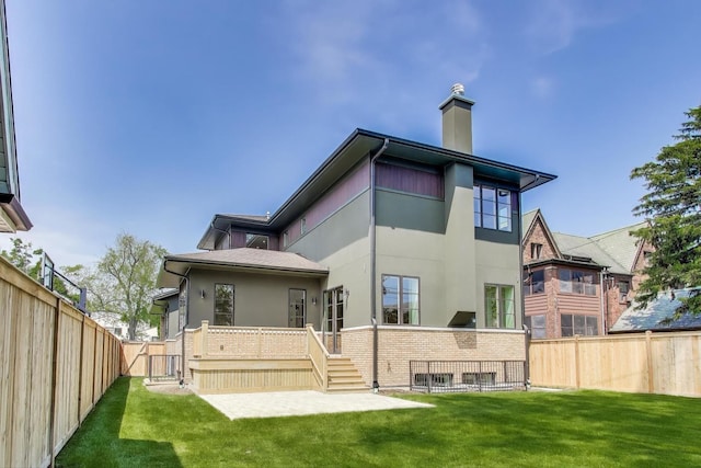1437 Ashland Ave, River Forest, IL 60305 - back of house featuring a fenced backyard, stucco siding, a chimney, a gate, and a deck