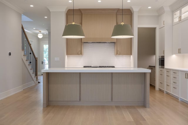 1437 Ashland Ave, River Forest, IL 60305 - kitchen with tasteful backsplash, light countertops, light wood-style flooring, recessed lighting, and a spacious island