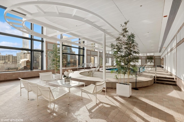 161 E Chicago Ave Unit 40G, Chicago, IL 60611 - common area with a towering ceiling, a city view, and expansive windows