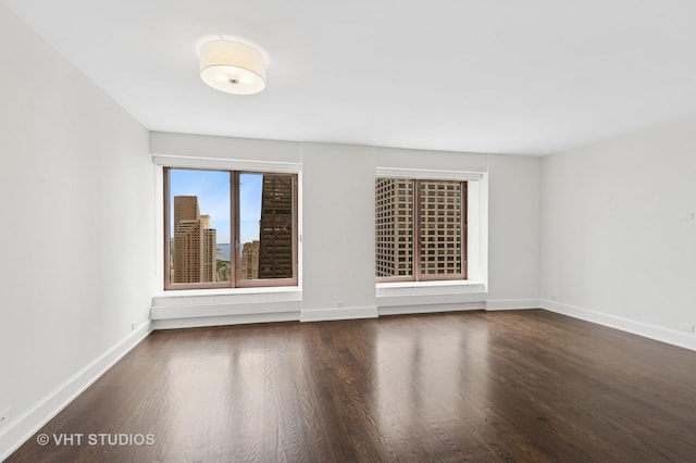 161 E Chicago Ave Unit 40G, Chicago, IL 60611 - spare room featuring wood finished floors and baseboards