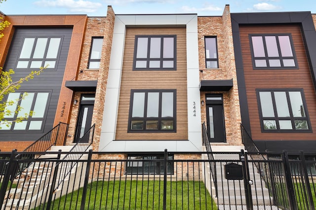 3452 N Central Ave, Chicago, IL 60634 - view of front of house featuring brick siding and a fenced front yard