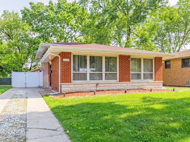 1330 E 146th St, Dolton, IL 60419 - view of front of property featuring brick siding and a gate