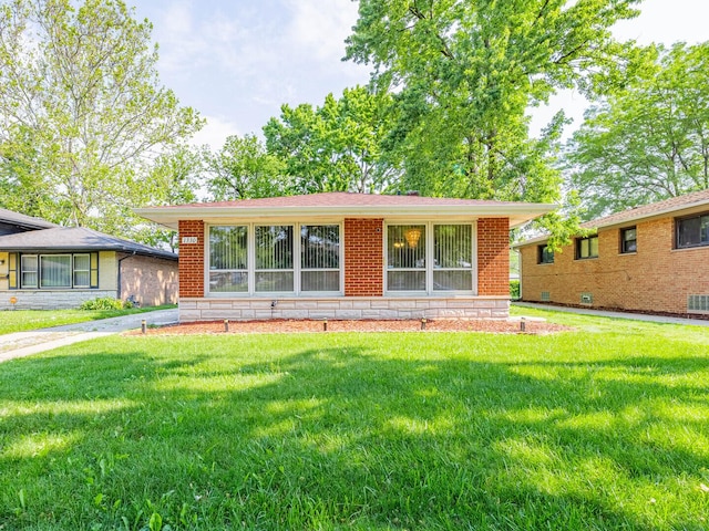 1330 E 146th St, Dolton, IL 60419 - view of front of home with a front yard and brick siding