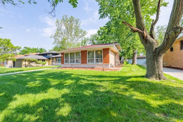1330 E 146th St, Dolton, IL 60419 - split level home featuring brick siding and a front lawn