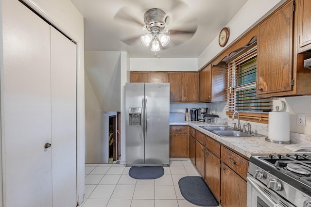 1330 E 146th St, Dolton, IL 60419 - kitchen featuring stainless steel appliances, brown cabinets, ceiling fan, and light countertops