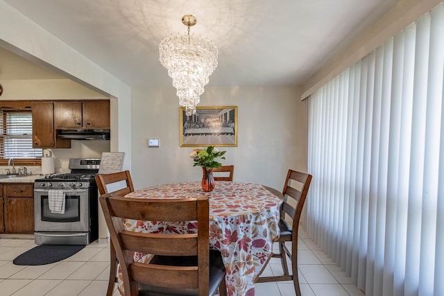 1330 E 146th St, Dolton, IL 60419 - dining space featuring light tile patterned floors and a chandelier