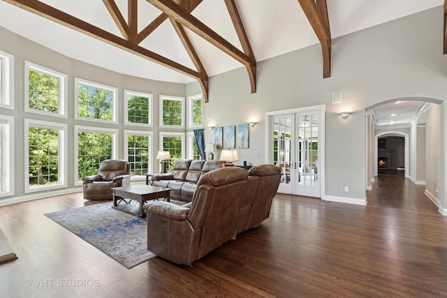 1310 Gavin Ct, Lake Forest, IL 60045 - living room with high vaulted ceiling, arched walkways, beamed ceiling, dark wood-style flooring, and french doors
