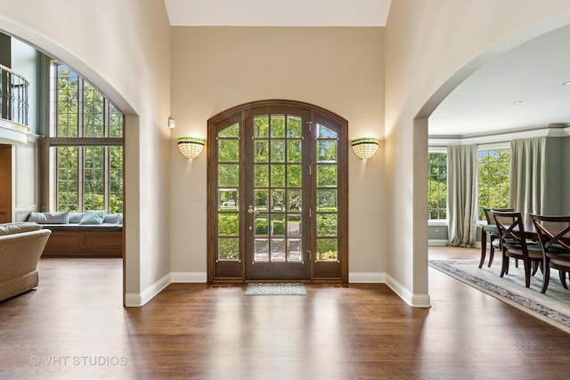 1310 Gavin Ct, Lake Forest, IL 60045 - foyer entrance featuring wood finished floors, arched walkways, and a high ceiling