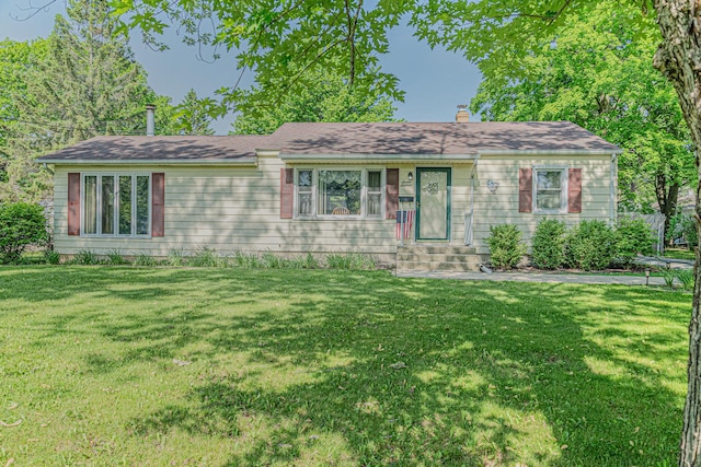 716 Kirkwood Ave, Winthrop Harbor, IL 60096 - single story home featuring a front lawn and a chimney