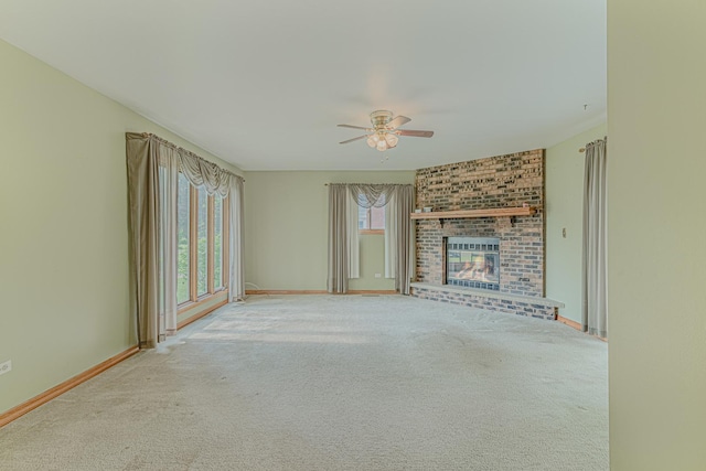 716 Kirkwood Ave, Winthrop Harbor, IL 60096 - unfurnished living room featuring a ceiling fan, a brick fireplace, and carpet