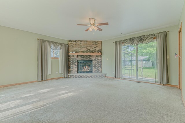 716 Kirkwood Ave, Winthrop Harbor, IL 60096 - unfurnished living room featuring ceiling fan, carpet floors, and a fireplace