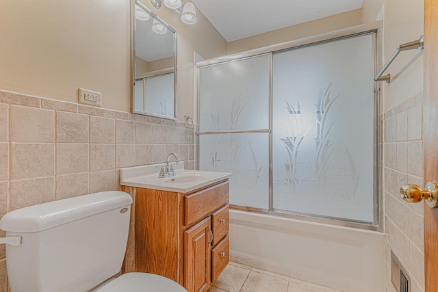 716 Kirkwood Ave, Winthrop Harbor, IL 60096 - bathroom featuring enclosed tub / shower combo, tile walls, vanity, and tile patterned floors