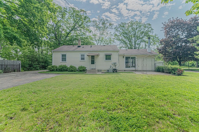 716 Kirkwood Ave, Winthrop Harbor, IL 60096 - back of property with a chimney and a patio area