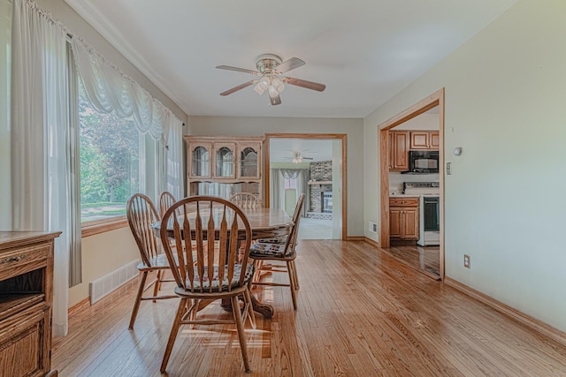 716 Kirkwood Ave, Winthrop Harbor, IL 60096 - dining space with ceiling fan and light wood-type flooring