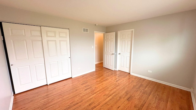 6024 Beechwood Rd, Matteson, IL 60443 - unfurnished bedroom featuring baseboards and light wood finished floors