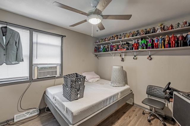 4636 S Keating Ave, Chicago, IL 60632 - bedroom with light wood-style flooring, cooling unit, and ceiling fan