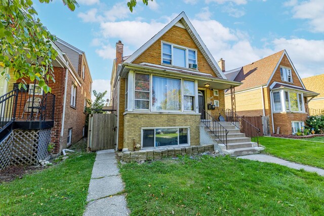 4636 S Keating Ave, Chicago, IL 60632 - bungalow-style house featuring brick siding, a gate, stairs, and a chimney