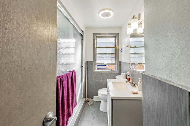4636 S Keating Ave, Chicago, IL 60632 - full bath with vanity, a wainscoted wall, and a shower with shower door