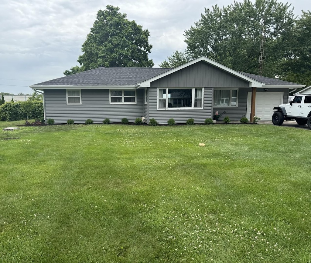 2365 Nan St, Aurora, IL 60502 - ranch-style house featuring a garage, a front lawn, and a shingled roof