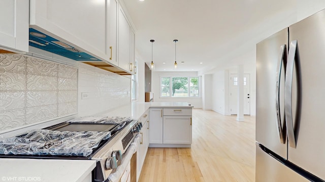 15230 State St, South Holland, IL 60473 - kitchen with appliances with stainless steel finishes, light wood-type flooring, a peninsula, decorative backsplash, and recessed lighting