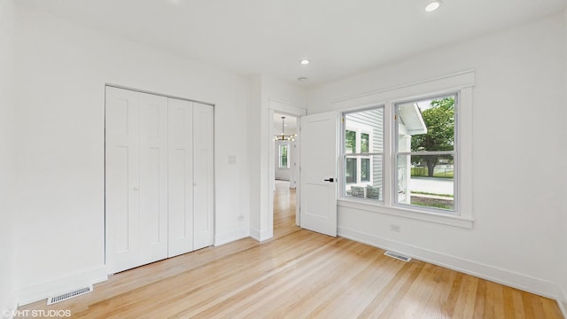 15230 State St, South Holland, IL 60473 - unfurnished bedroom with wood finished floors, recessed lighting, and a closet